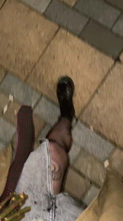 Woman documents evening with flowers and wine in Tbilisi