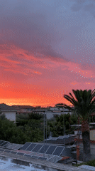 Vibrant sunset illuminates residential Aprilia, Italy on May 14