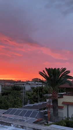 Vibrant sunset illuminates residential Aprilia, Italy on May 14