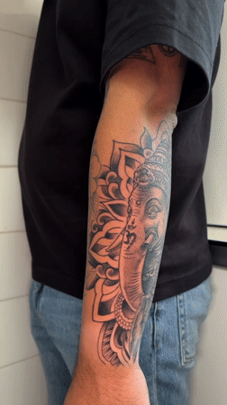 Man displays intricate forearm tattoo in Madrid