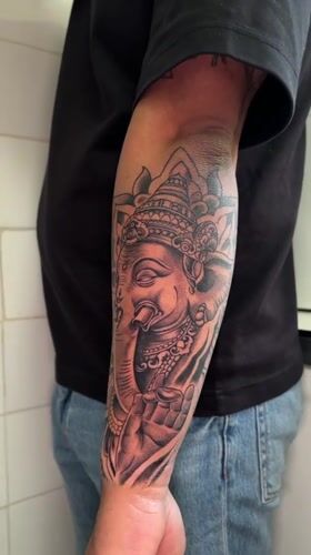 Man displays intricate forearm tattoo in Madrid