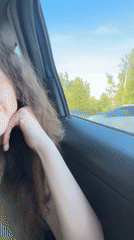 Woman's afternoon car journey includes restaurant dining in European city