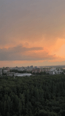 Perm at dusk: forest and city skyline from above