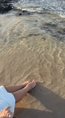 Beachgoer enjoys gentle waves at Al Fiqait shore