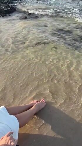 Beachgoer enjoys gentle waves at Al Fiqait shore