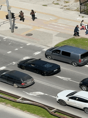 Traffic stops at light in sunny Plovdiv street scene