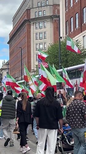 Demonstrators march with Iranian flags through Leeds streets