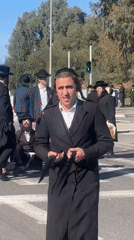 Orthodox men help fallen pedestrian at Kiryat Ono crosswalk
