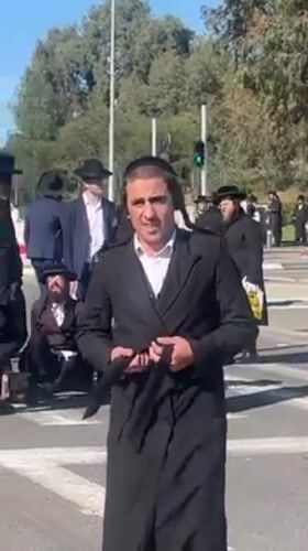 Orthodox men help fallen pedestrian at Kiryat Ono crosswalk