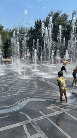 Kids cool off at Yerevan's public fountains on a summer morning