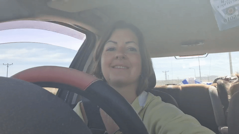 Woman with glitter, nose piercing drives in Lachish region