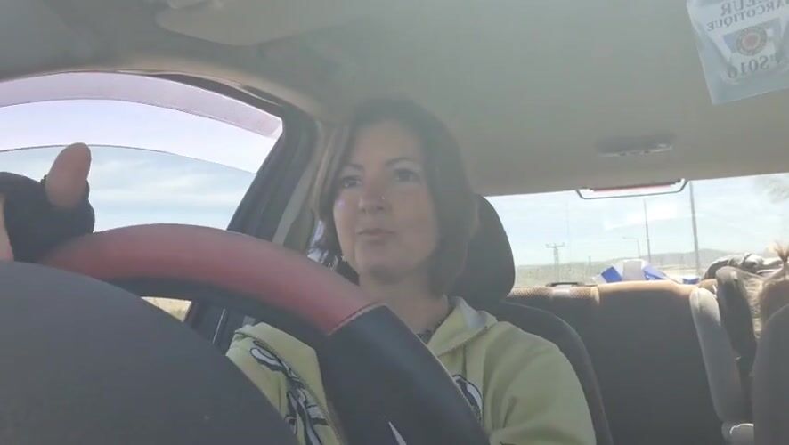 Woman with glitter, nose piercing drives in Lachish region