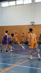 Basketball game and coaching on a blue court in Castelo Branco