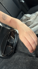 Woman applies makeup in car in Rishon LeZion