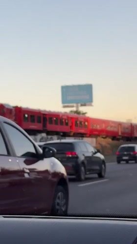 Evening rush hour traffic, train, helicopter observed in Buenos Aires