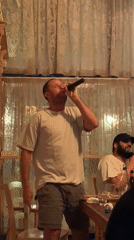 Casual karaoke or sing-along in a cozy Tel Aviv room