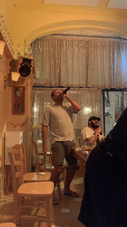 Casual karaoke or sing-along in a cozy Tel Aviv room