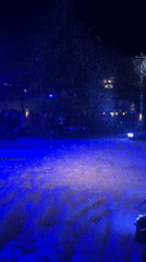 Winter-themed outdoor party with artificial snow draws crowds in Milan