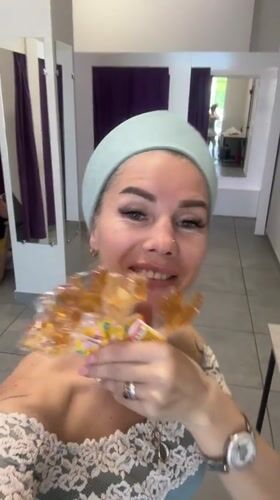 Woman with rooster lollipops films herself in Abakan store
