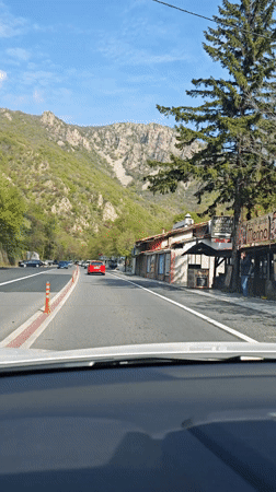 Morning traffic flows on mountain highway near Stara Kresna