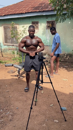 Man performs bodybuilding poses outdoors in Akwanga, Nigeria