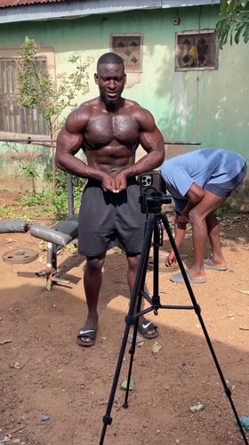 Man performs bodybuilding poses outdoors in Akwanga, Nigeria