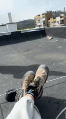 Worker spotted on rooftop overlooking Burgas city skyline