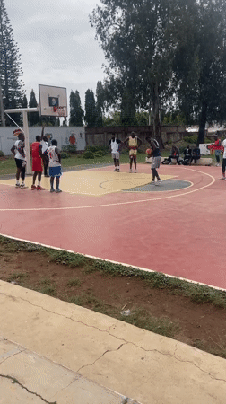 Basketball game played on outdoor court in Jos, Nigeria
