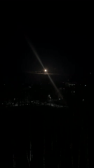 Full moon illuminates Chaikovsky, Russia with visible light beam