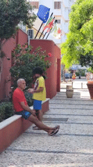 Lazy afternoon on Quarteira's cobblestone streets, cat and all