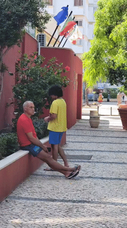 Lazy afternoon on Quarteira's cobblestone streets, cat and all