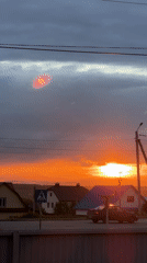 Dramatic sunset illuminates residential area, captured by multiple witnesses