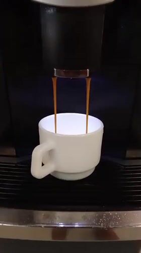 Coffee machine dispenses espresso in Santiago cafe