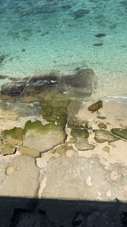 Two swimmers spotted in clear waters near Ungasan, Indonesia