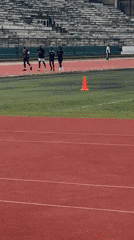 Track runners and football squad share New Stadium in morning training
