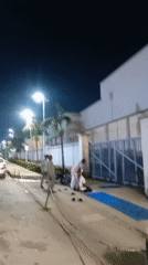 Evening street life and prayer gathering in Ikeja, Nigeria