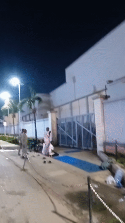 Evening street life and prayer gathering in Ikeja, Nigeria