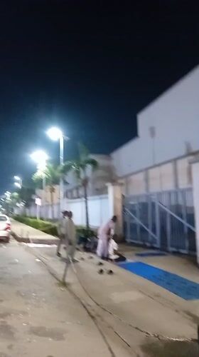 Evening street life and prayer gathering in Ikeja, Nigeria
