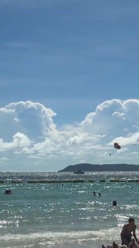 Sunny morning beach activity recorded in Pattaya, Thailand