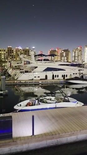 Evening waterfront walk through Doha's Pearl-Qatar marina district