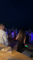 Varna beach party night: DJ booth, lights, and summer crowds