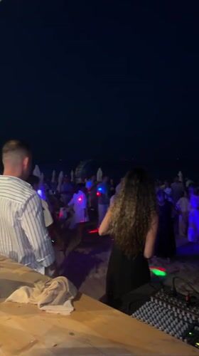 Varna beach party night: DJ booth, lights, and summer crowds