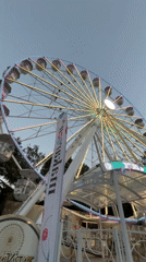Illuminated Ferris wheel at a Burgas amusement park, evening