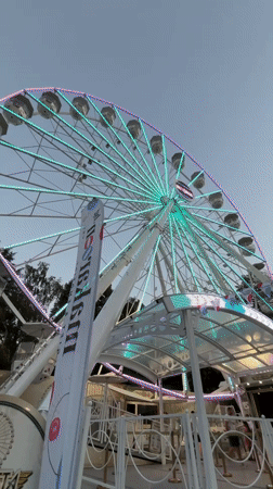 Illuminated Ferris wheel at a Burgas amusement park, evening