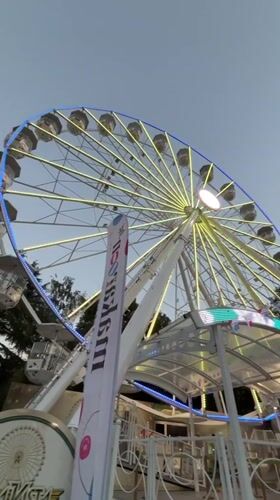 Illuminated Ferris wheel at a Burgas amusement park, evening