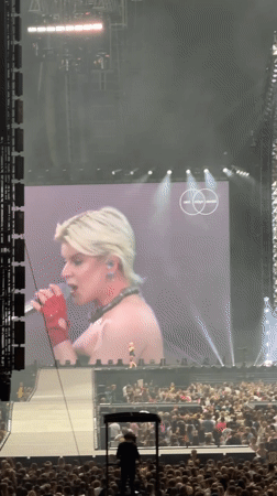 Blonde performer in black dress draws massive crowd Amsterdam concert