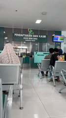 Busy morning at Gresik's Ibnu Sina hospital registration desk