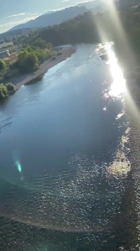 Morača River and blooming oleanders on a sunny Podgorica morning