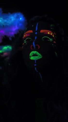 Blacklight face paint and overcast skies in Noviy, Russia