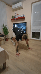 Man performs calisthenics workout in Varna living room